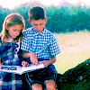 Jenny (Hanna Hall) looking at a book with her friend Forrest (Michael Conner Humphreys), 'Forrest Gump,' 1994. Pictures, Images and Photos