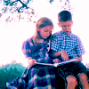 Jenny (Hanna Hall) looking at a book with her friend Forrest (Michael Conner Humphreys), 'Forrest Gump,' 1994. Pictures, Images and Photos