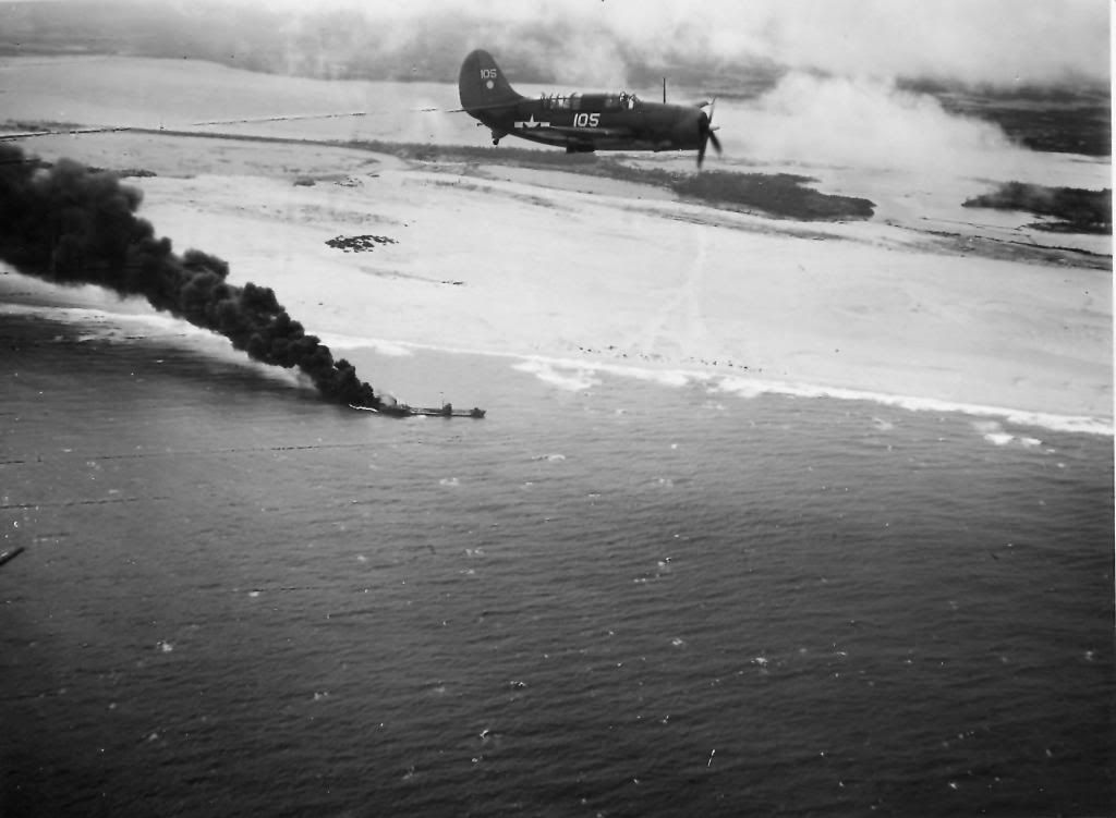 US_Navy_Helldiver_flying_over_a_burning_Japanese_tanker_January_1945_zps251196c8.jpg