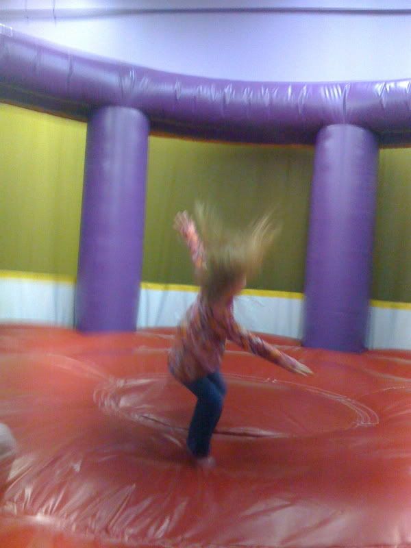 Lexi spinning in the big trampoline.