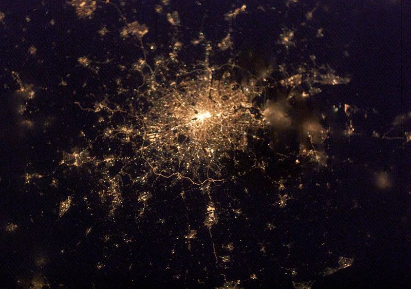 city lights from space. of city lights surrounding