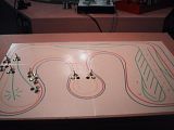 2006-07-30ControlPanel.jpg Control Panel:   
It\'s a free standing console on wheels connected to the layout with a 4\' bundle of wires.  Schematic was created in Xtrkcad then laminated. image by jxtrrx