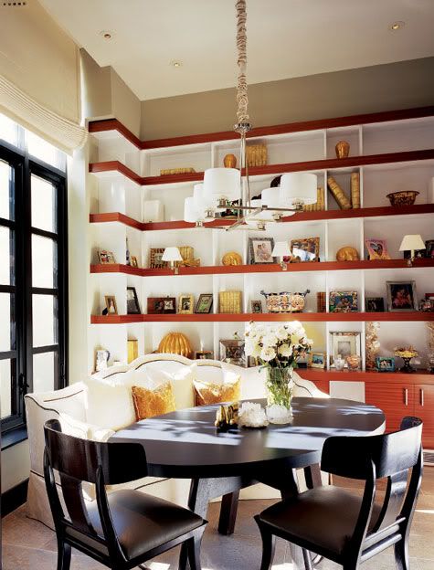 dining room with tall book shelves