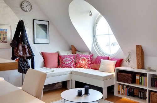 white sitting room with big circle window