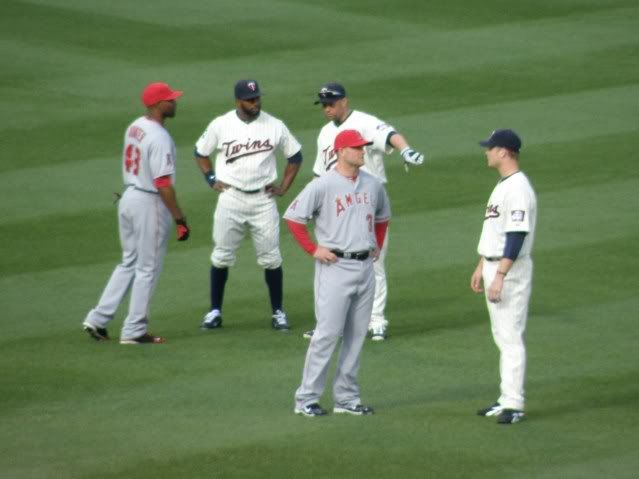 Minnesota Twins' Justin Morneau, right, hugs pitcher Joe Nathan as