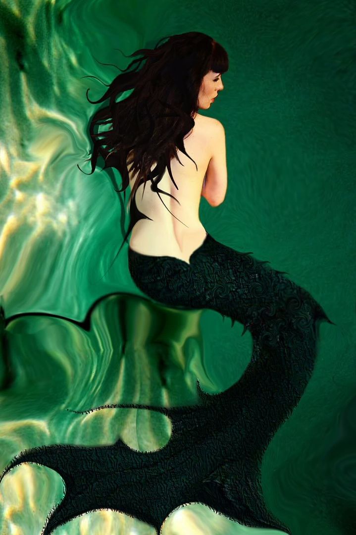 Spiral Aquatic Angel by Violetarojo Melissa Wolverton is sitting deep in the ocean on a rock ledge she is portrayed as a mermaid. Thee original photograph of Spiral used to draw this image was by Scott Sage and was taken in 2009. 