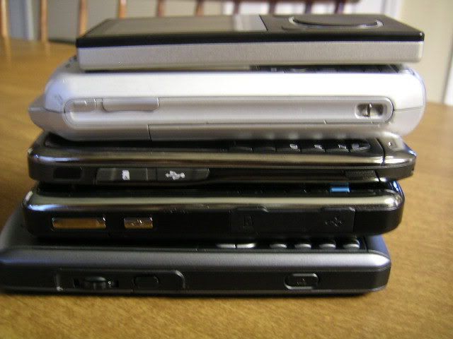 Stacked (Bottom to Top): Ubiquio 503G, HP 910, Nokia E71, TMobile SDA, Zune 8GB